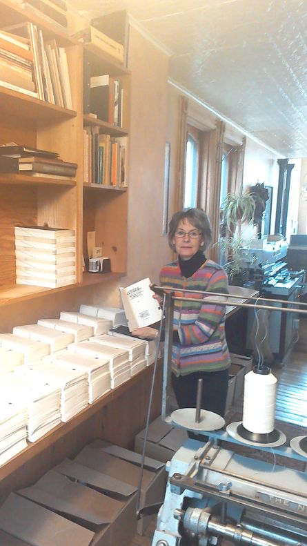 Elke displays the printed signatures for Sweet Lechery. Look at how neatly everything is stacked!