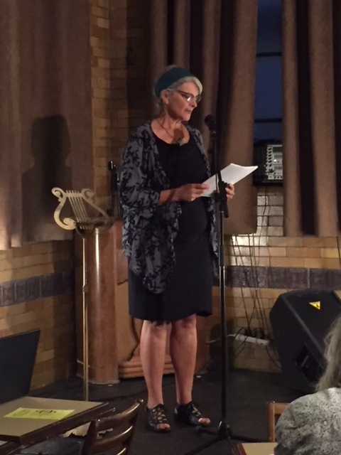 Barbara Sibbald reading on stage.