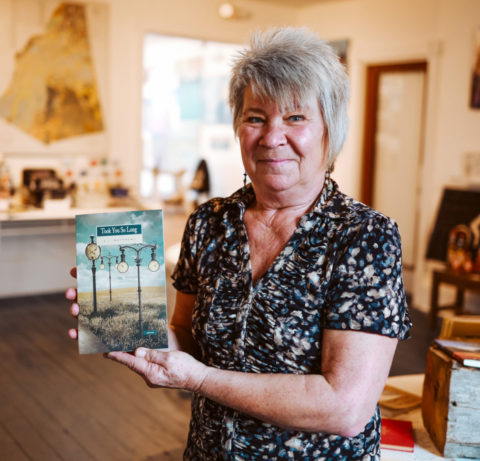 Cindy Matthews holding her short story collection Took You So Long. Photo by Jenni Welsh.